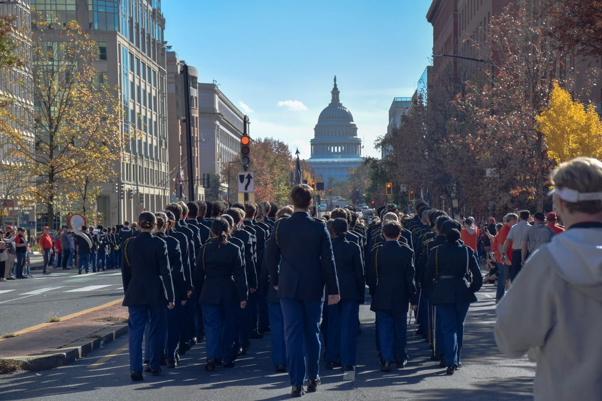 The cadet corps march on Eye St. before SJC vs Gonzaga