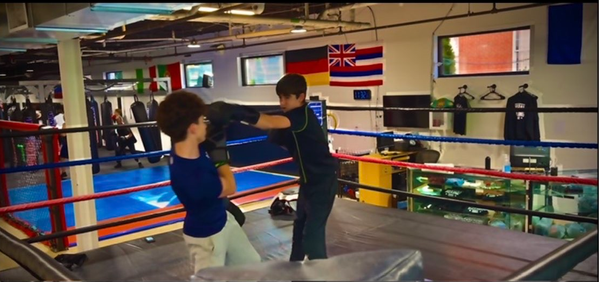 Sports outside of SJC: Andrew DeLuca '28 on balancing boxing and tennis